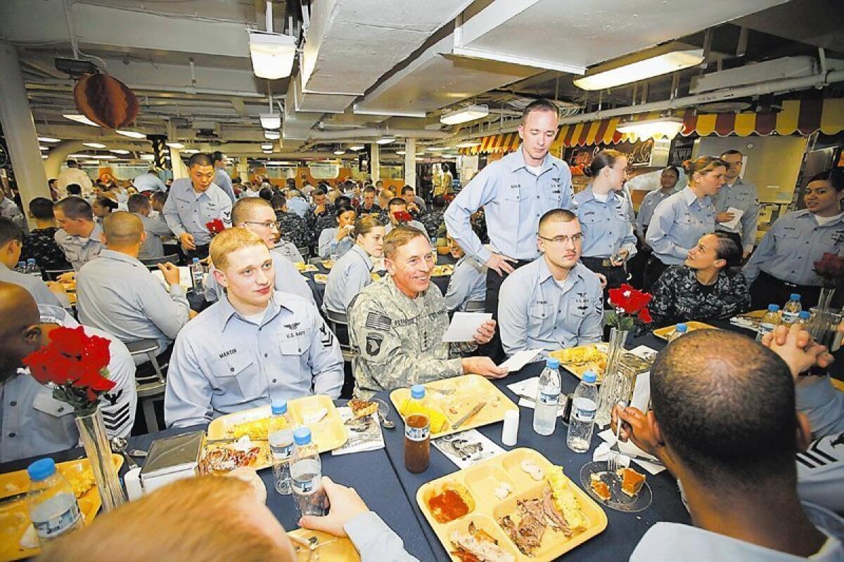 Gen. David Petraeus had Thanksgiving dinner with the crew aboard the San Diego-based aircraft carrier Nimitz. The carrier, in the Gulf of Oman, left San Diego in July for an eight-month deployment. Nelvin C. Cepeda / Union-Tribune