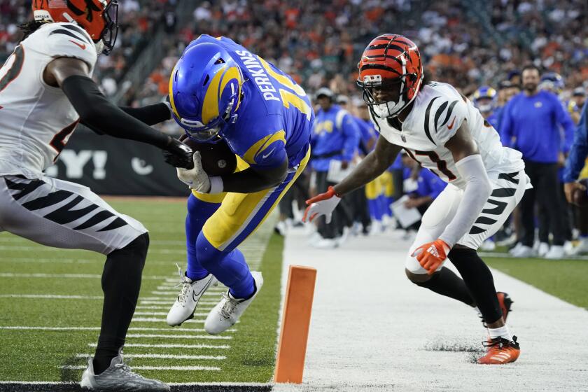 Los Angeles Rams quarterback Bryce Perkins (16) runs for a touchdown against the Cincinnati Bengals during the second half of a preseason NFL football game in Cincinnati, Saturday, Aug. 27, 2022. (AP Photo/Joshua A. Bickel)