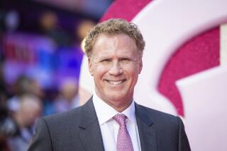Will Ferrell in a grey suit wearing a pink tie smiling at a red carpet premiere for Barbie