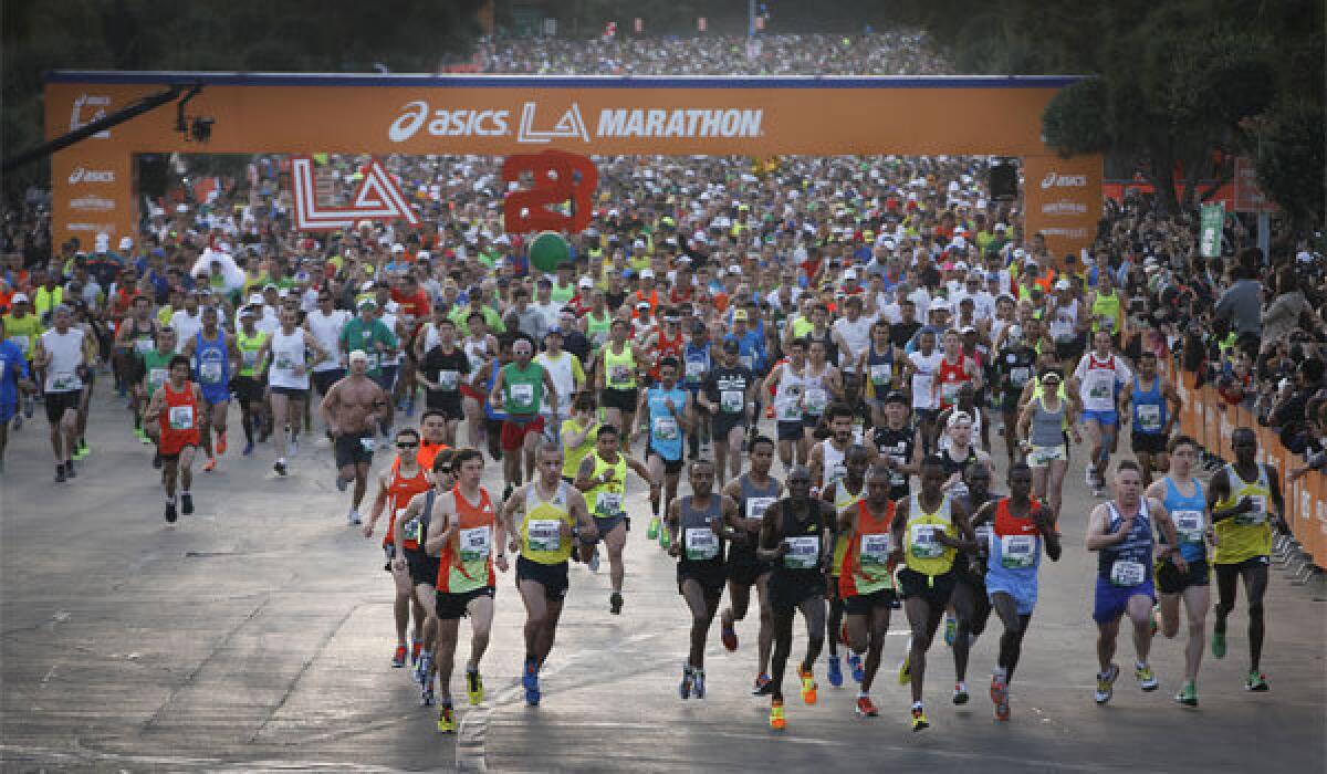 Runners start the 2013 ASICS L.A. Marathon at Dodger Stadium.