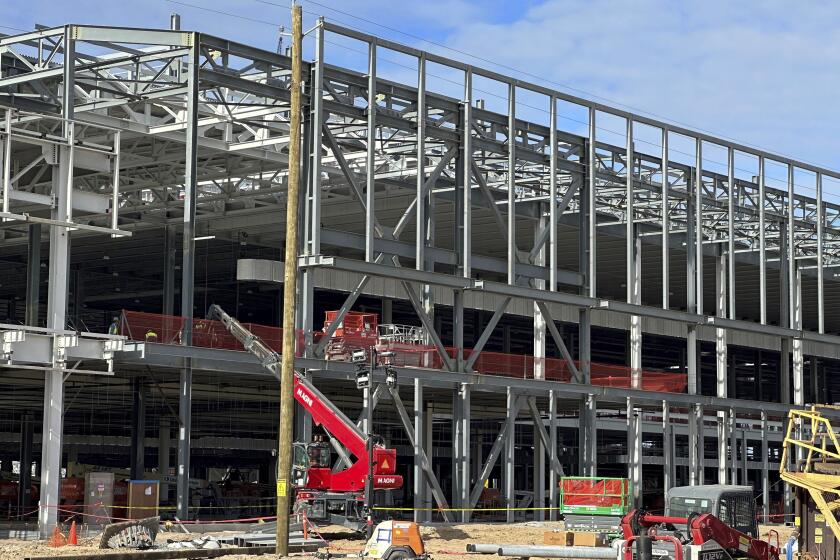 FILE - A factory building is under construction at Hyundai's first U.S. plant for manufacturing electric vehicles on Wednesday, Oct. 25, 2023, in Ellabell, Ga. A private utility is asking Georgia lawmakers to change a state law so it can provide water service to new homes near Hyundai's upcoming electric vehicle plant without getting permission from local governments. A state Senate committee in Atlanta voted Tuesday, March 12, 2024, to advance the proposal a week after it passed the House. (AP Photo/Russ Bynum, File)