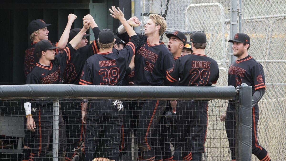 Huntington Beach High's Justin Brodt, shown with his teammates on March 9, 2018, came through late in the Oilers' 8-6 win over Newport Harbor on Thursday.