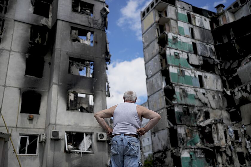 A man near demolished buildings in Borodyanka, Ukraine, on Saturday.