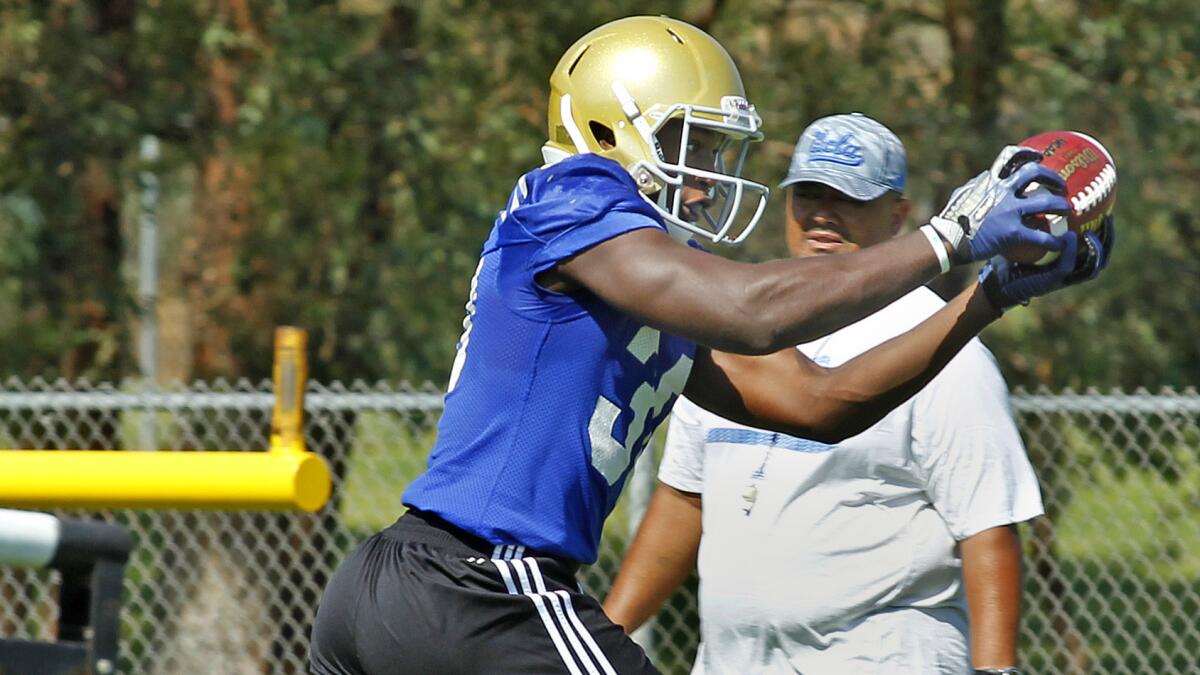 UCLA's Myles Jack catches a pass during a team practice session at Cal State San Bernardino on Aug. 4.