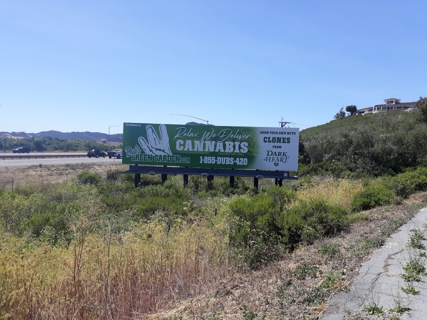 A billboard on a roadside in San Luis Obispo County reads, "Relax. We deliver cannabis." 