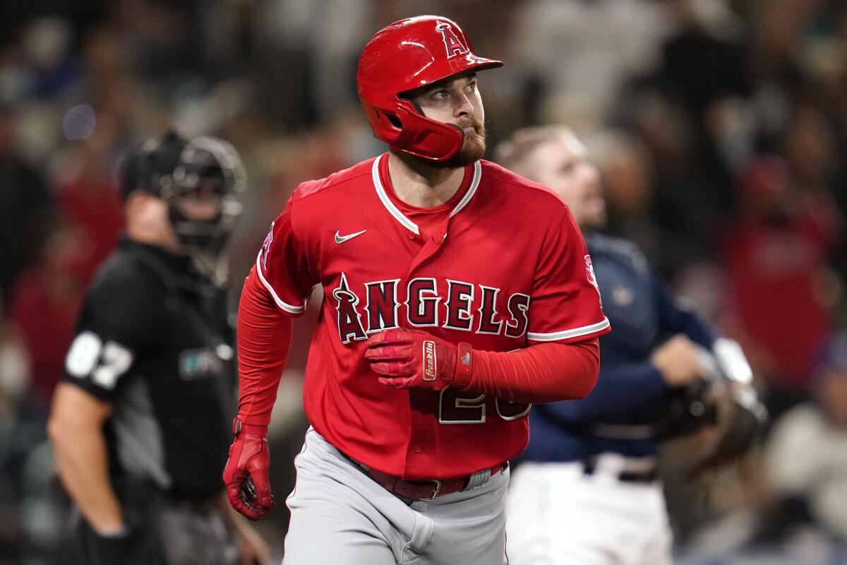 The Angels' Jared Walsh watches his three-run home run against the Seattle Mariners in the eighth inning Oct. 2, 2021.