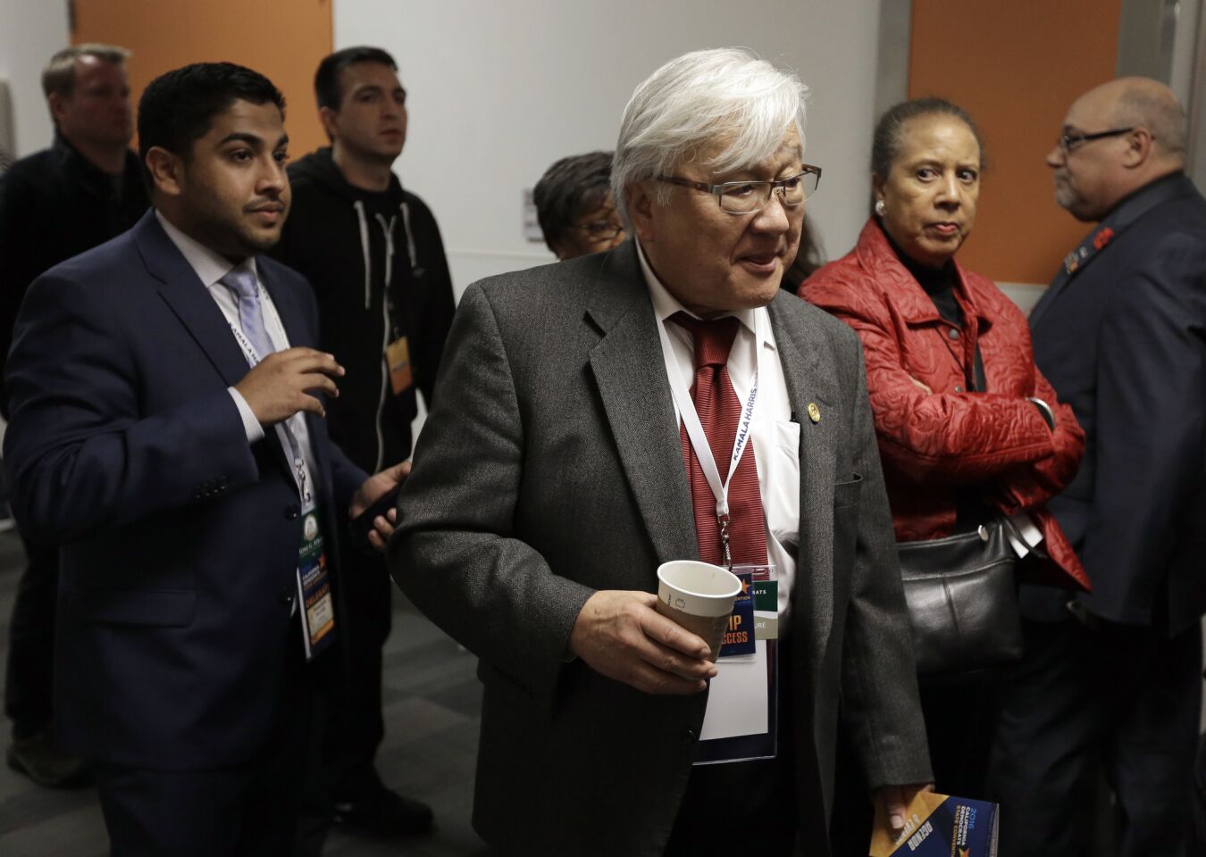 Rep. Michael M. Honda, D-San Jose, center, exits the main hall during a break in the California Democratic Party Convention on Saturday in San Jose.