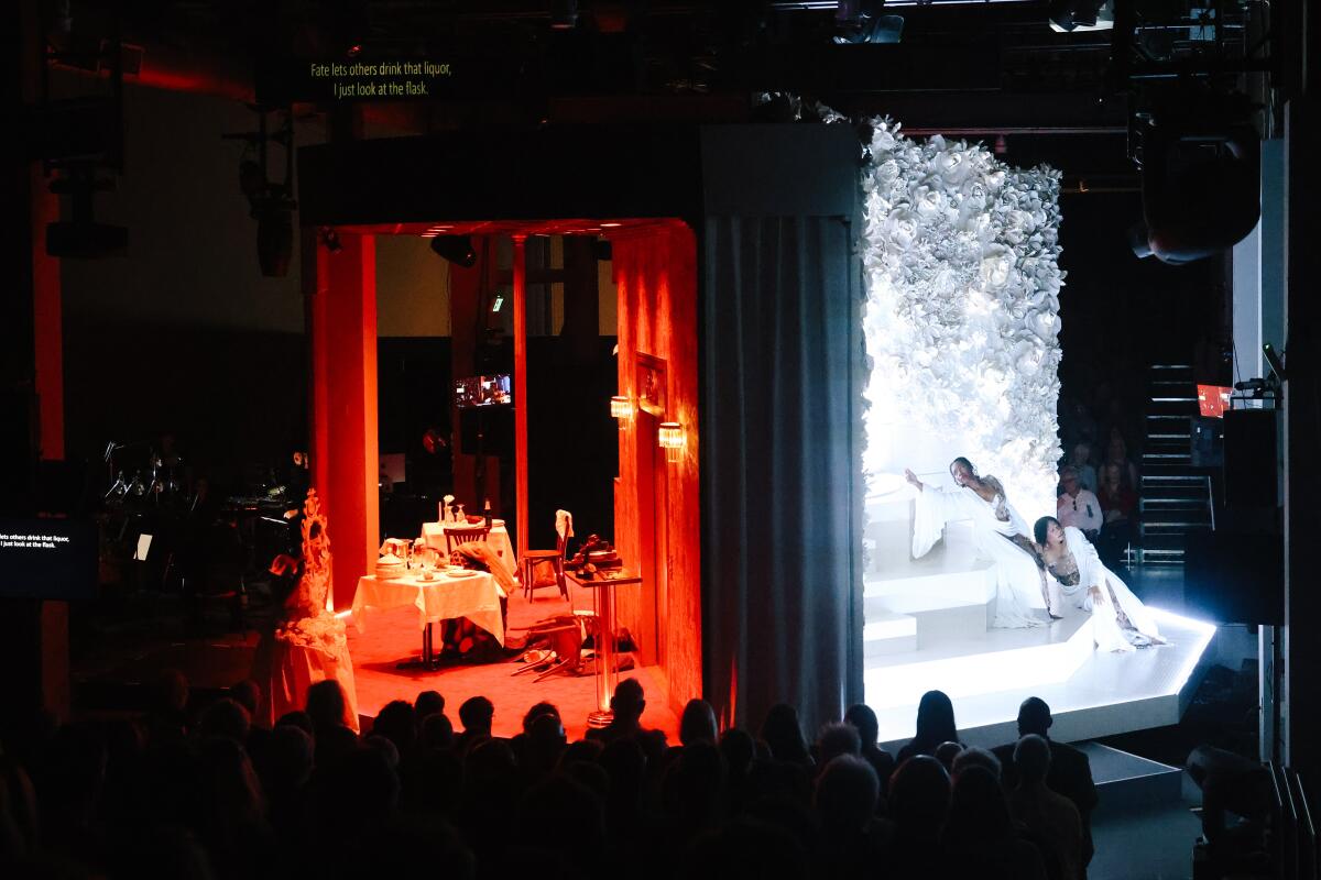 The two sides — one red and the other white — of the revolving stage of "The Comet / Poppea."