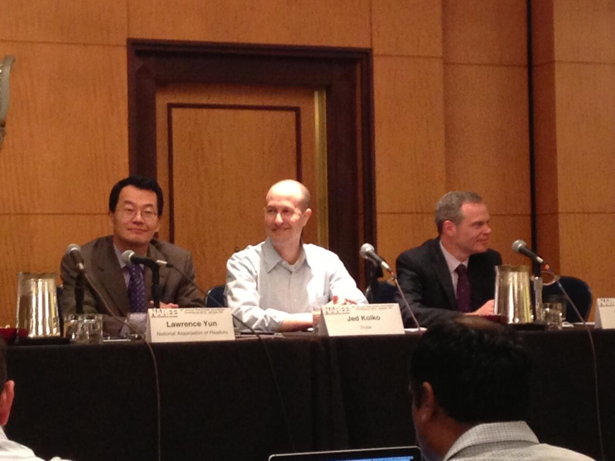 Economists Lawrence Yun, left, Jed Kolko and Mark Fleming discuss the outlook for housing at the National Assn. of Real Estate Editors conference in Atlanta.