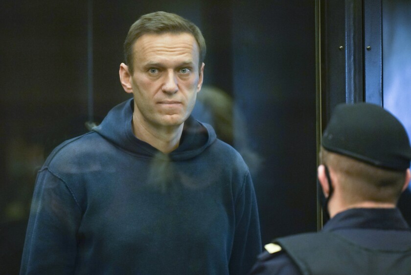 Russian opposition activist Alexei Navalny inside a glass enclosure in court.