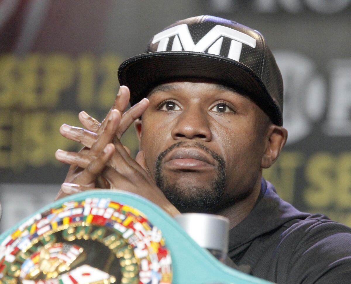 Floyd Mayweather Jr. takes questions during a news conference in Los Angeles on Thursday, Aug. 6, 2015. Mayweather is scheduled to face Andre Berto in a boxing bout Sept. 12 in Las Vegas.