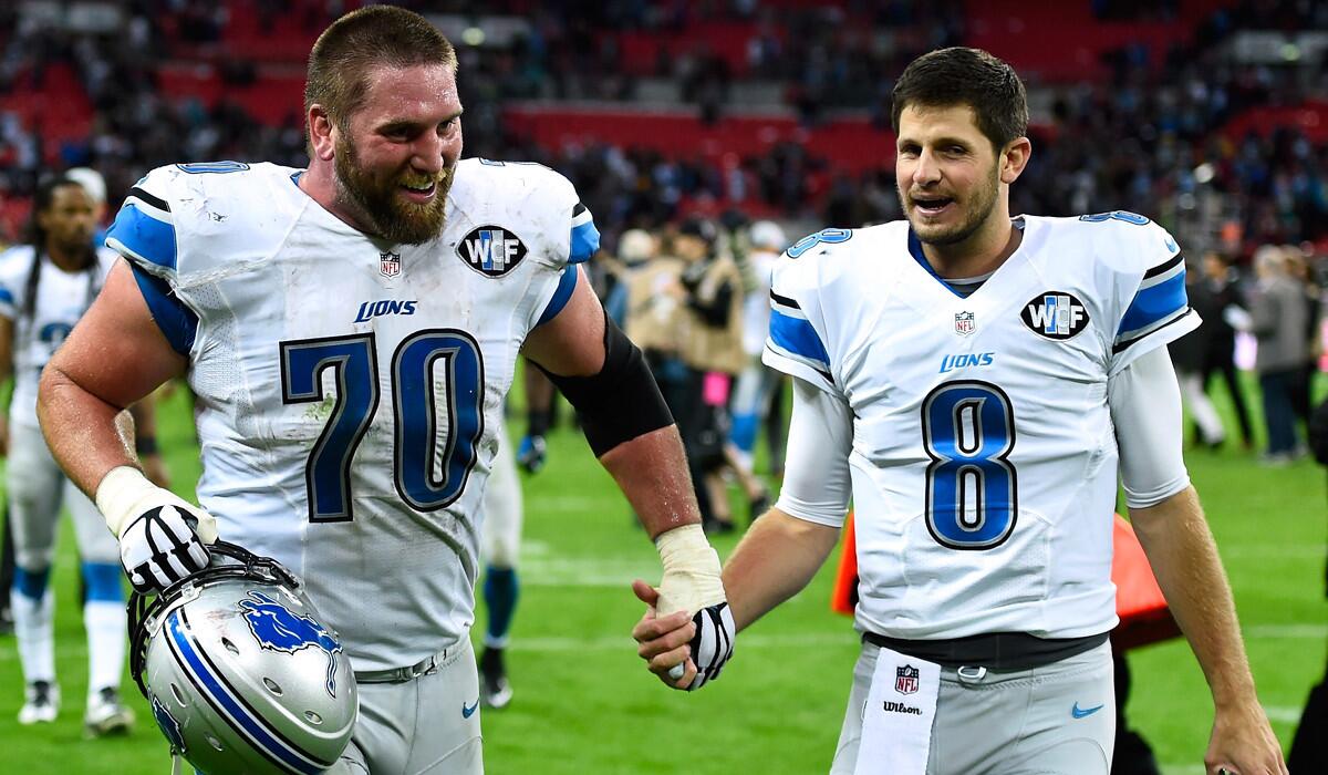 Lions backup quarterback Dan Orlovsky (8) and offensive guard Garrett Reynolds (70) celebrate after a victory over the Atlanta Falcons at Wembley Stadium in London last month.
