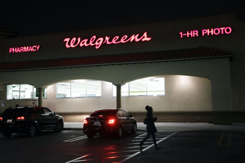 FILE - This June 24, 2019 file photo shows an exterior view of a Walgreens store in Los Angeles. Walgreens will pay $7.5 million to settle with California authorities after an employee was criminally charged with impersonating a pharmacist and illegally filling more than 745,000 prescriptions in the San Francisco Bay Area. Kim Thien Le has pleaded not guilty to felony impersonation charges. (AP Photo/Marcio Jose Sanchez,File)