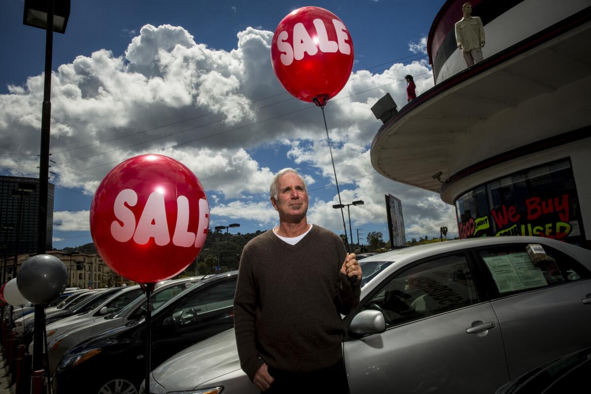 Joel Surnow, shown at a Studio City used car lot, is the director of "Small Time."