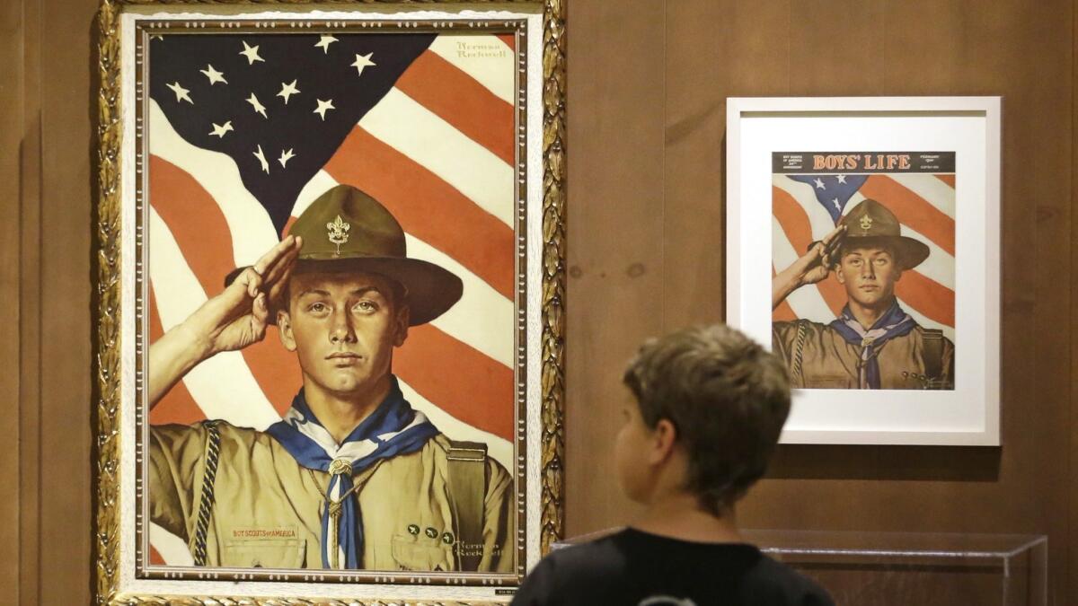 Boy Scout-themed Norman Rockwell paintings are on display at the Mormon Church History Museum in Salt Lake City in 2013. The church said Tuesday it will cut ties with the Boy Scouts of America.