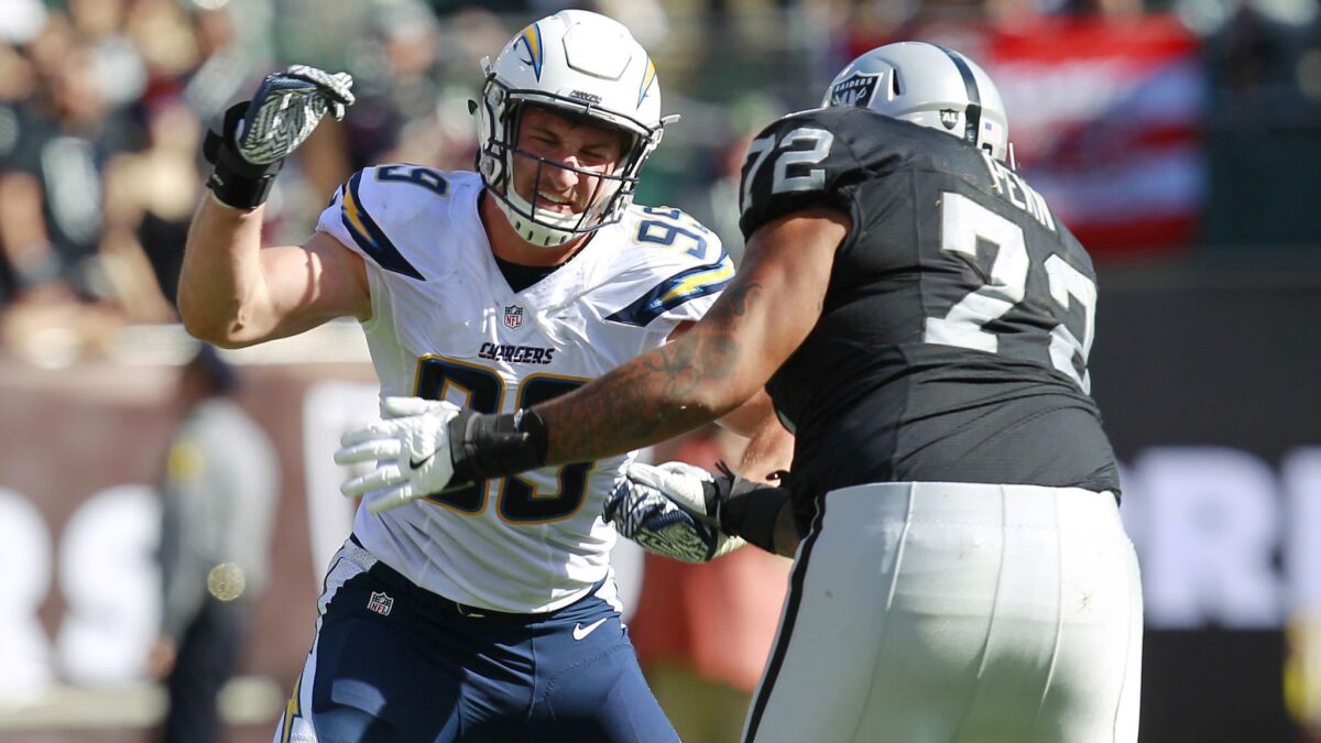 Chargers defensive end Joey Bosa rushes against Raiders tackle Donald Penn in a 2016 game.