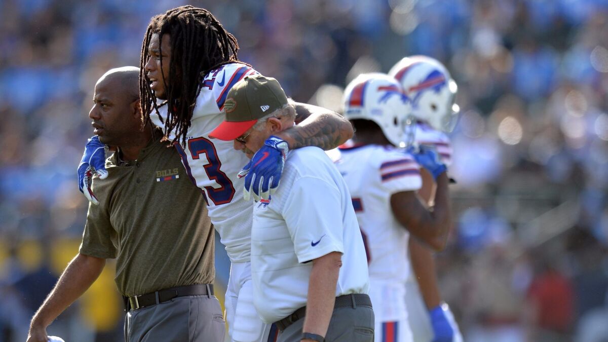 Buffalo Bills wide receiver Kelvin Benjamin is helped off the field during the first quarter of a game against the Los Angeles Chargers.