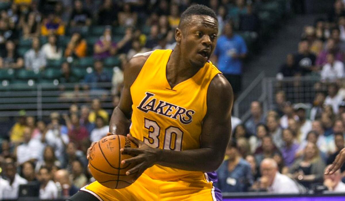 Lakers forward Julius Randle controls the ball against the Jazz during the second half of a preseason game Sunday in Honolulu.