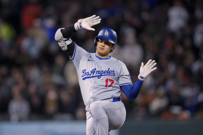 Los Angeles Dodgers' Shohei Ohtani celebrates after hitting an RBI double against the San Francisco Giants during the seventh inning of a baseball game Tuesday, May 14, 2024, in San Francisco. (AP Photo/Godofredo A. Vásquez)
