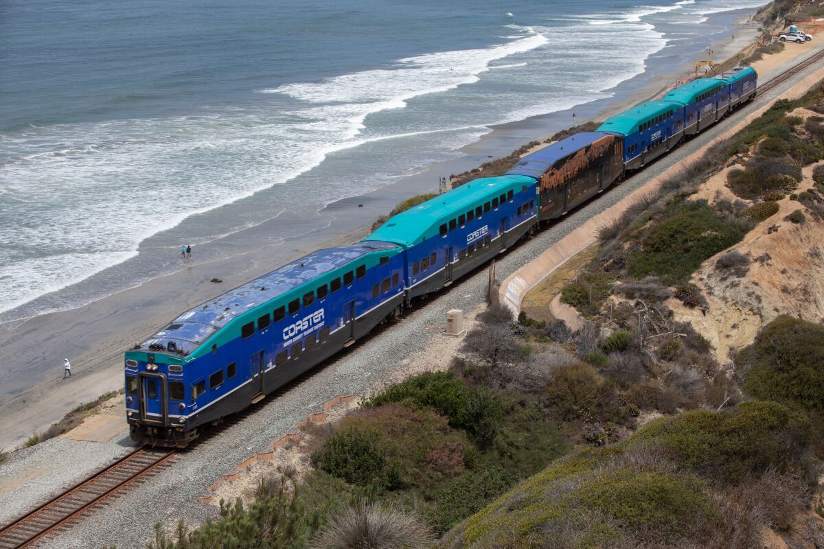 A Coaster train passes along the beach in Del Mar on Friday.