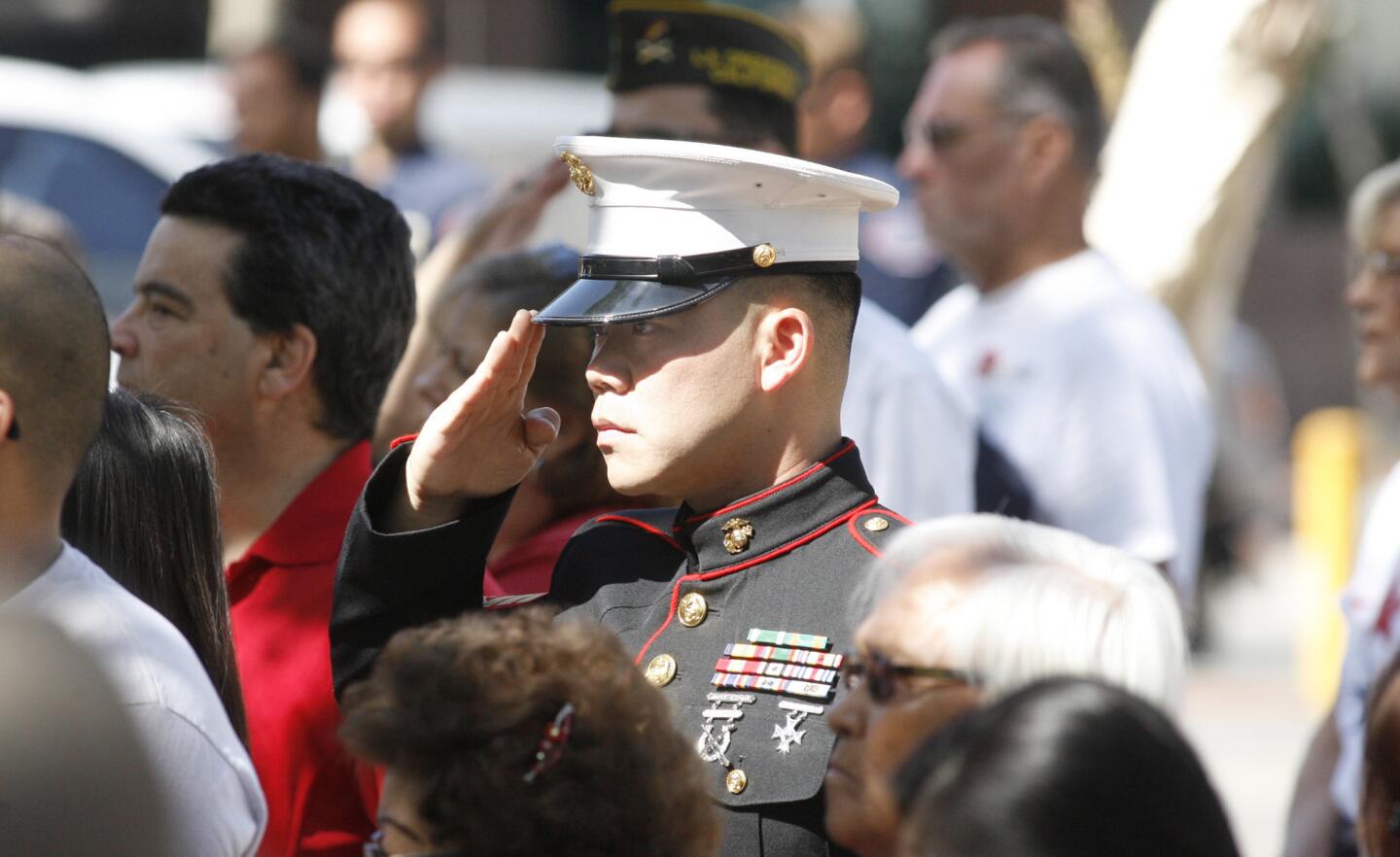 Marine Sgt. Thomas Dang, of Glendale, salutes during the National Anthem at the City of Glendale's Memorial Day ceremony at City Hall.