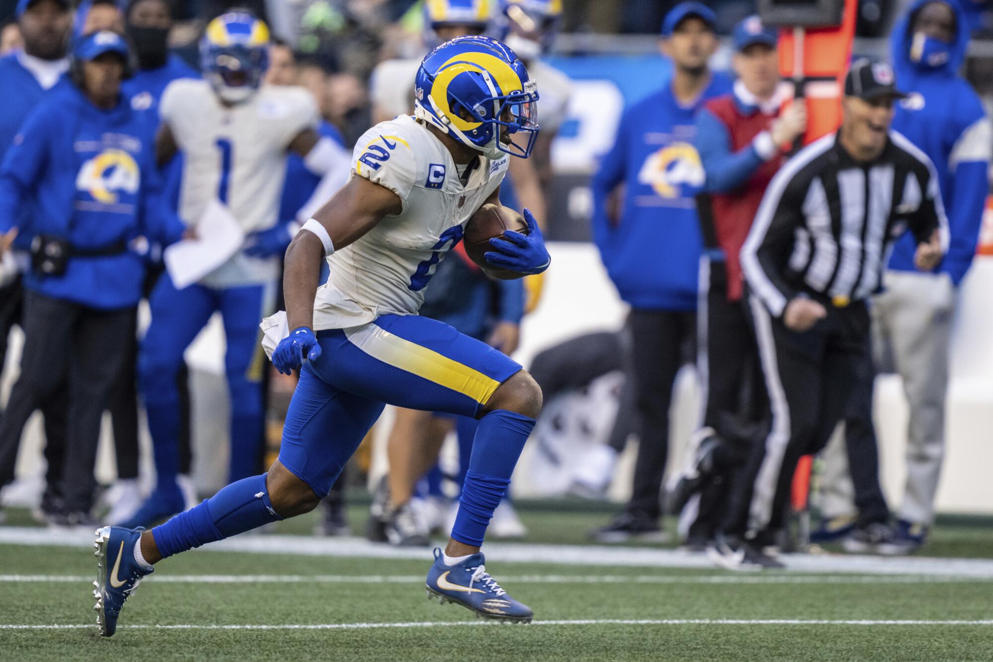 Rams wide receiver Robert Woods runs with the ball.