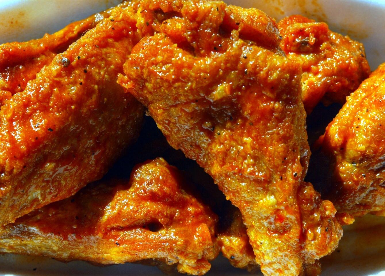 On the snack table, the hot Buffalo chicken wings can out-shout the party music. Talk about needy.