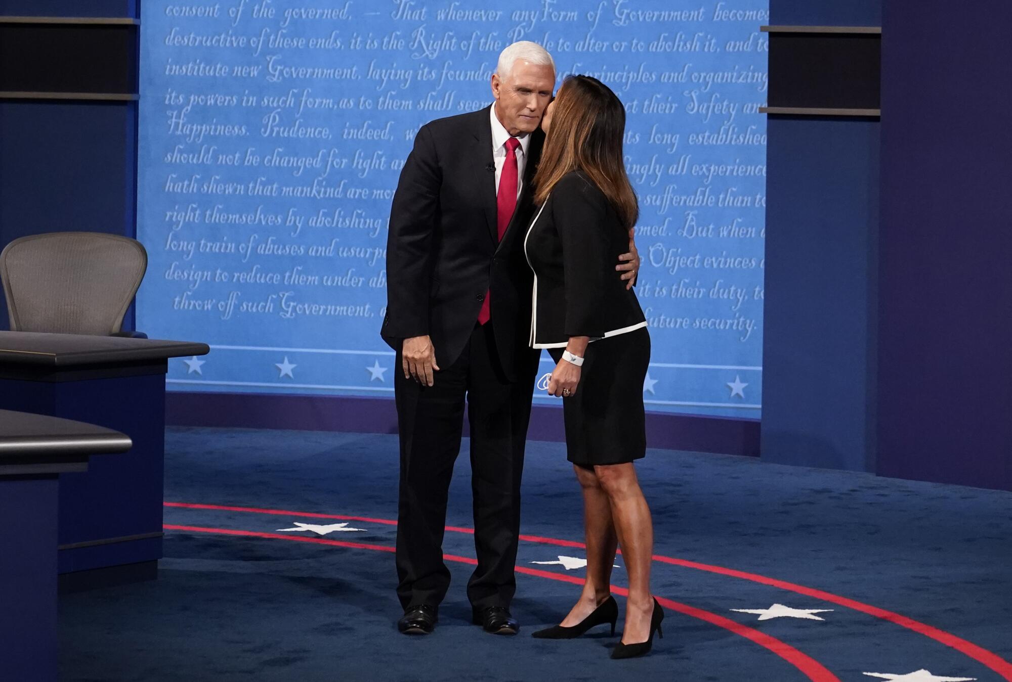 Vice President Mike Pence is kissed by his wife