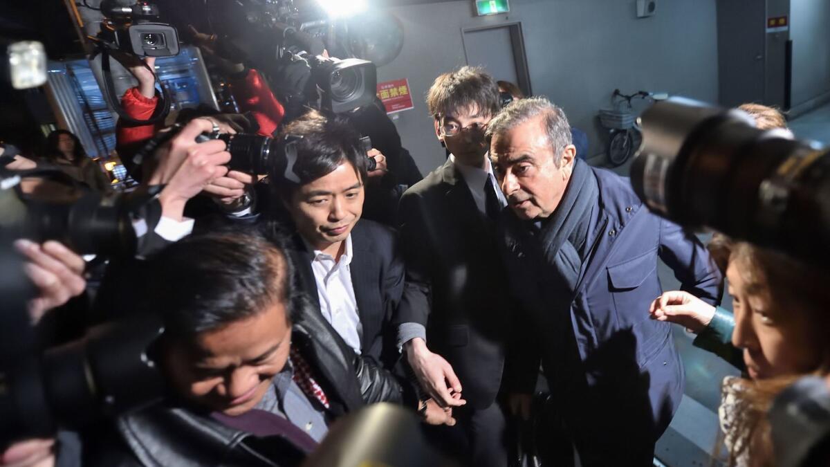 Former Nissan Chairman Carlos Ghosn leaves his lawyer's office in Tokyo on April 3.