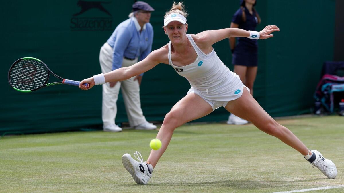 U.S. player Alison Riske returns against Australia's Ashleigh Barty during their fourth-round match Monday at Wimbledon.