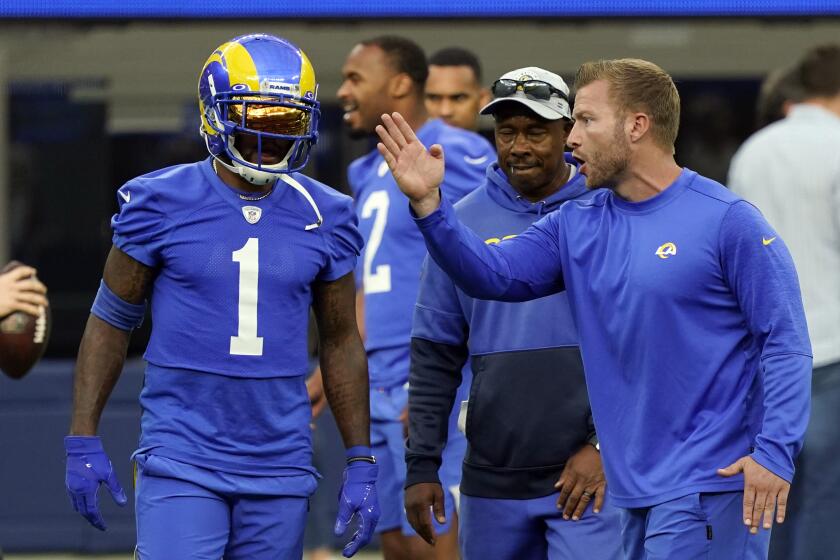 Los Angeles Rams coach Sean McVay, right, talks to wide receiver DeSean Jackson during the NFL football team's camp Thursday, June 10, 2021, in Inglewood, Calif. (AP Photo/Marcio Jose Sanchez)