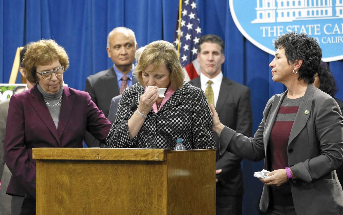 Debbie Ziegler is comforted by Sen. Lois Wolk, left, and Assemblywoman Susan Talamantes Eggman as she appeared in support of proposed legislation to legalize doctor-assisted suicide. Ziegler's daughter Brittany Maynard moved to Oregon to end her own life.