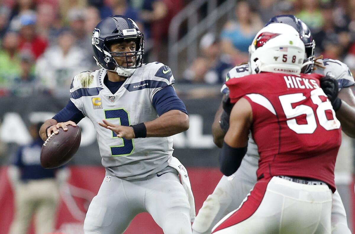 Seattle Seahawks quarterback Russell Wilson passes against the Arizona Cardinals on Sunday.