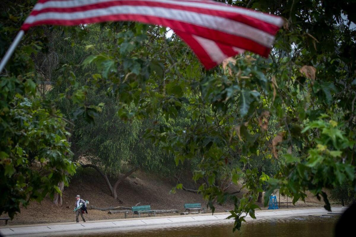 Eric Callow walks back to the the clubhouse of the Pasadena Casting Club, which was founded in 1947. Although there are dozens of fishing clubs across California, Pasadena is one of only three with its own casting pond