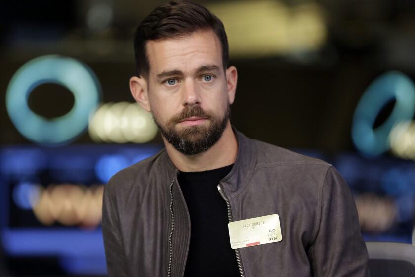 FILE- This Nov. 19, 2015, file photo shows Square CEO and Twitter CEO Jack Dorsey being interviewed on the floor of the New York Stock Exchange. In a series of tweets late Tuesday, Aug. 7, 2018, Dorsey defended Twitter's decision not to ban right-wing conspiracy theorist Alex Jones and his "Infowars" show, as many other social media platforms have done, saying he did not break any rules. (AP Photo/Richard Drew, File)