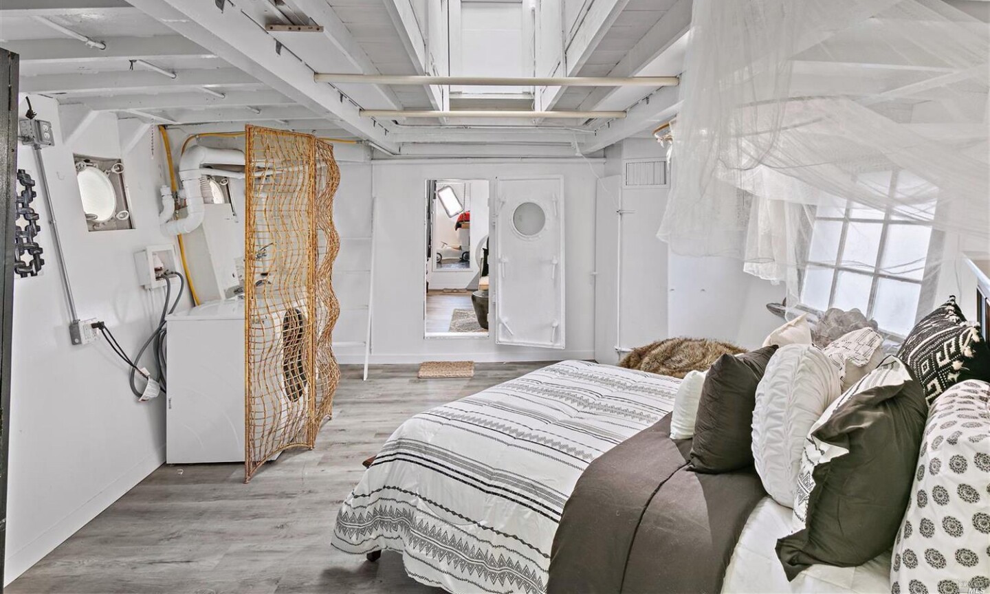 The decommissioned navy vessel boasts two bedrooms, a bathroom and bohemian living spaces in 1,200 square feet.