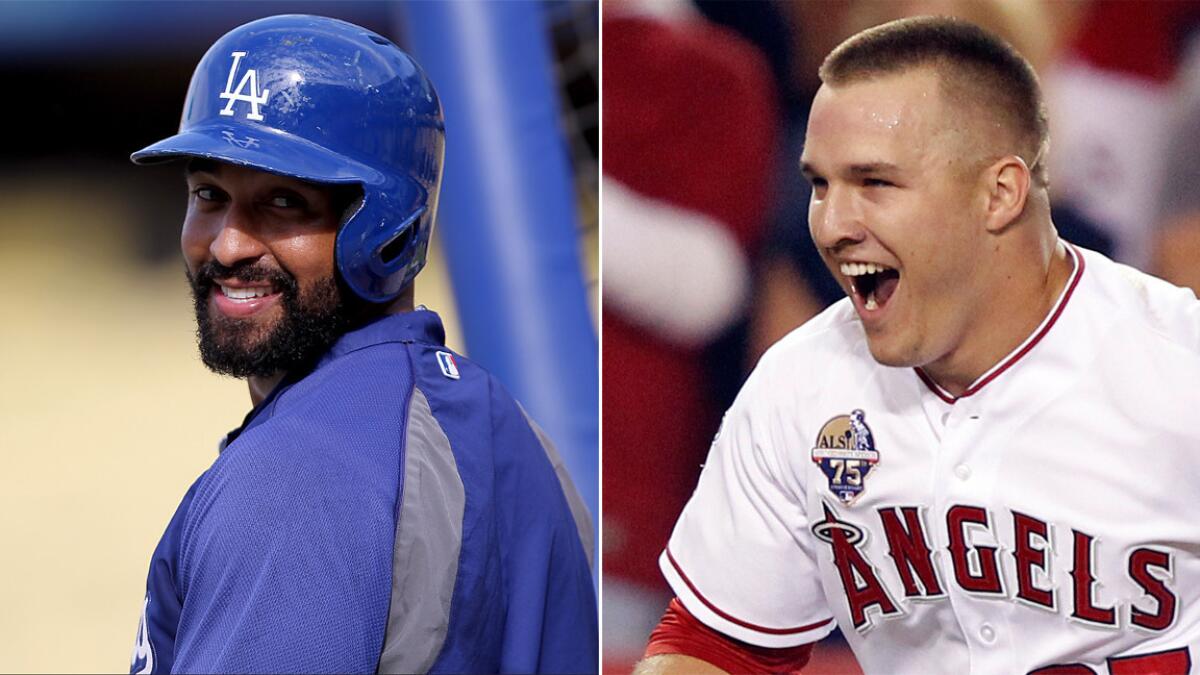 Dodgers outfielder Matt Kemp, left, and Angels center fielder Mike Trout have each done their part to keep their teams in the hunt for their respective division titles.