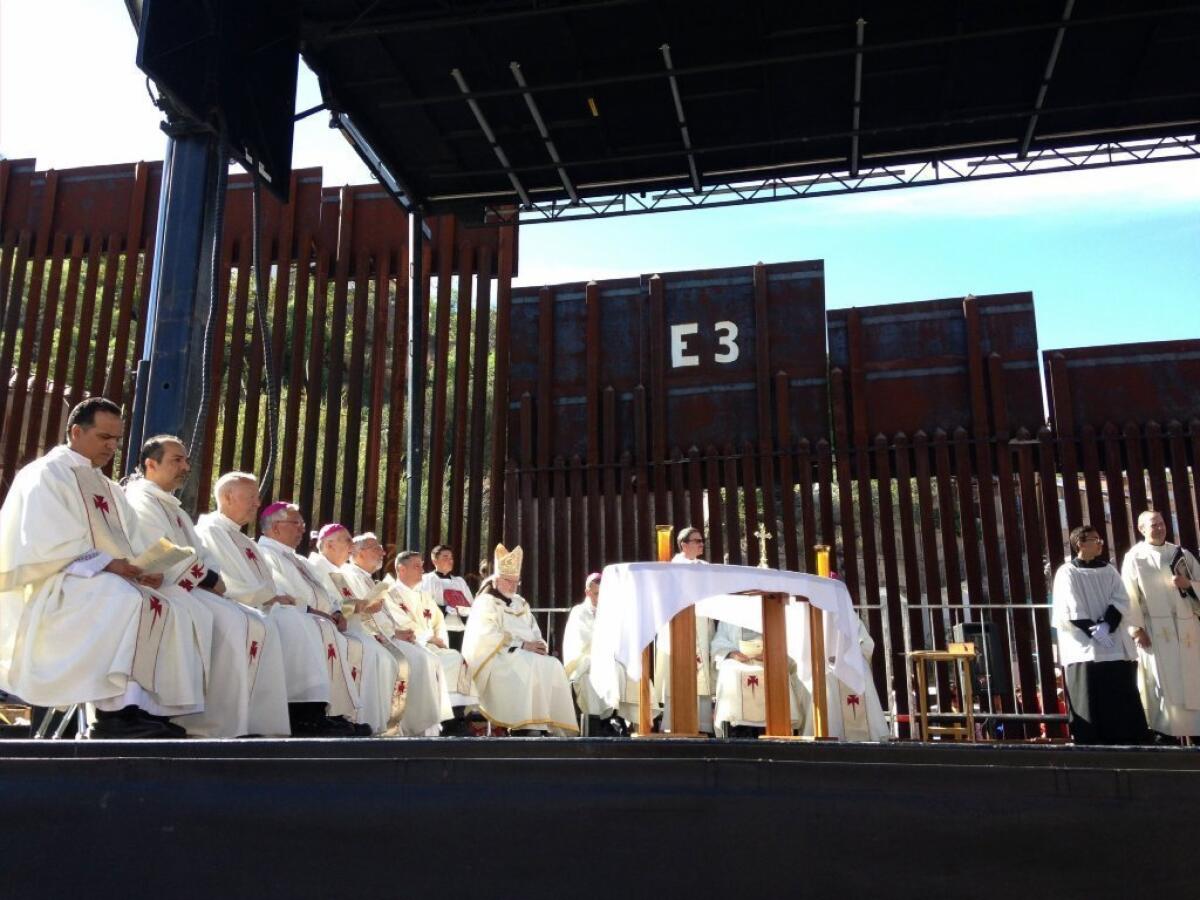 Roman Catholic bishops celebrate Mass at the border fence in Nogales, Ariz., on April 1.