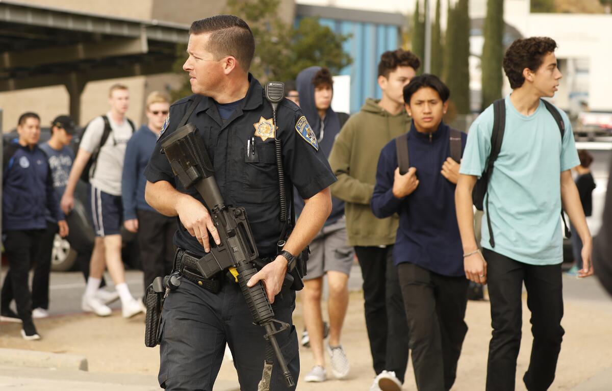 Students were escorted by police from the campus at Saugus High School.