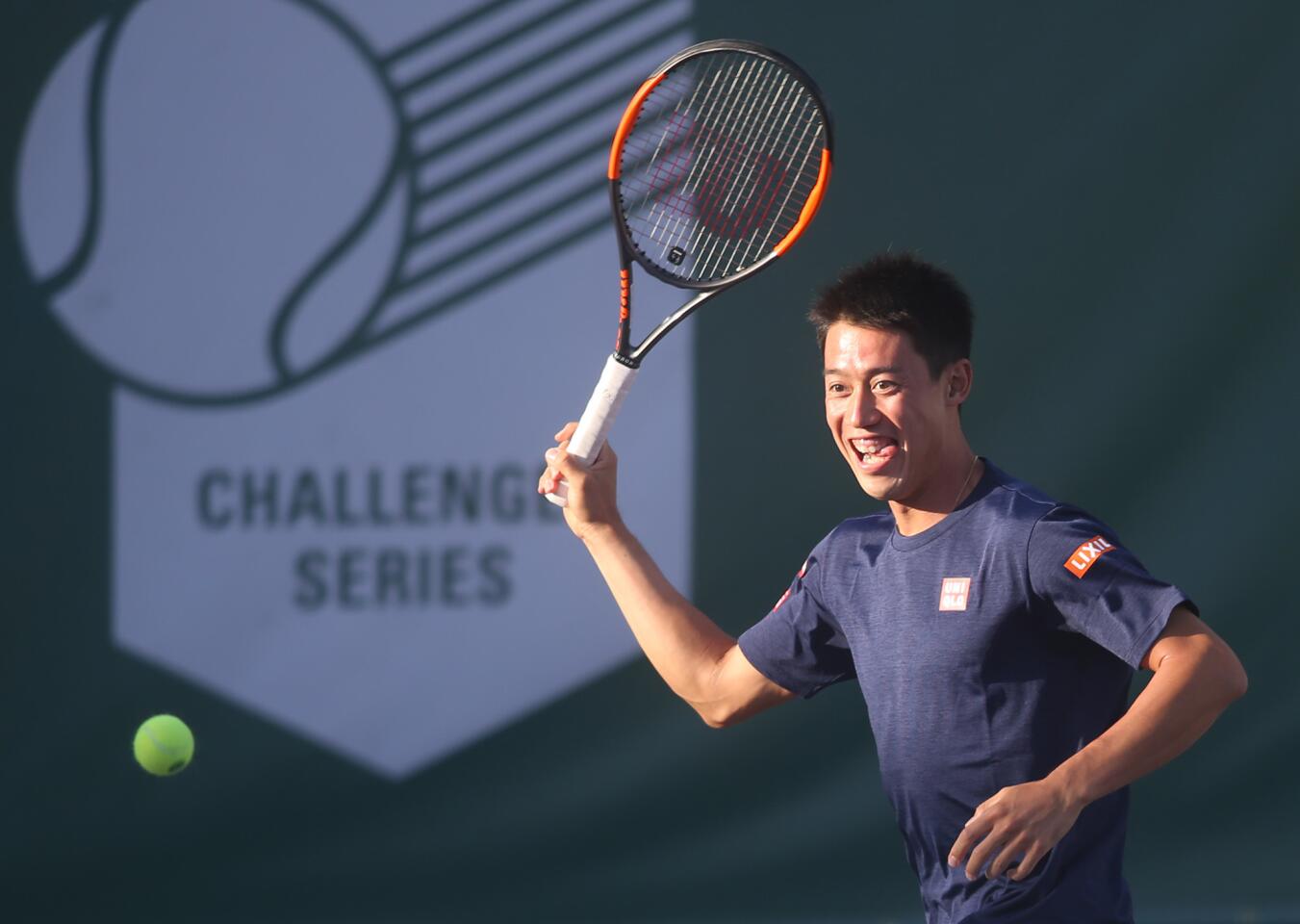 Japan's No. 1 rated player Kei Nishikori, makes a forehand return as he participates in the 8th annual Michael Chang Tennis Classic at the Newport Beach Tennis Club on Saturday. The event raise funds for HomeAid Orange County and the Chang Family Foundation.
