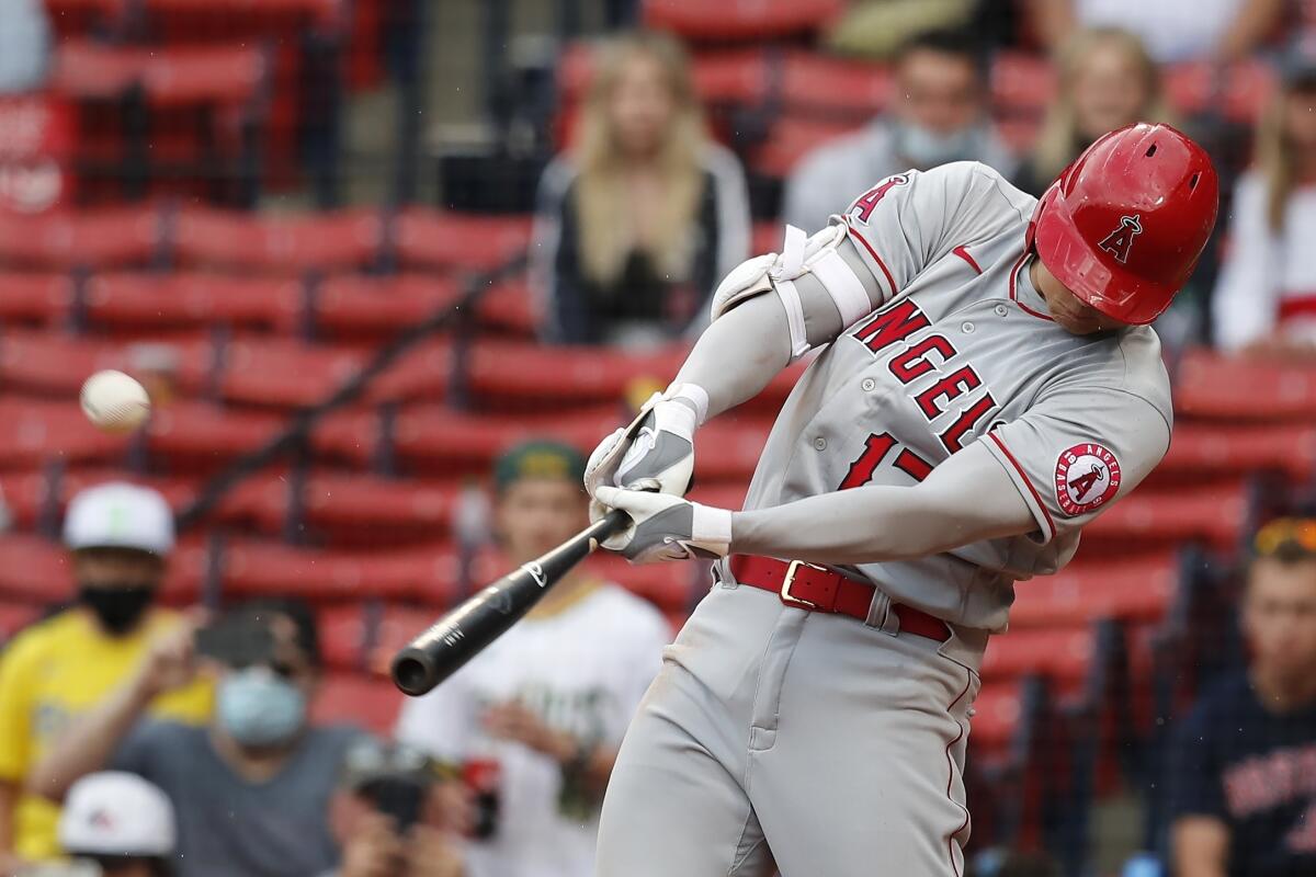 Los Angeles Angels' Shohei Ohtani hits a two-run home run during the ninth inning of a baseball game against the Boston Red Sox, Sunday, May 16, 2021, in Boston. (AP Photo/Michael Dwyer)