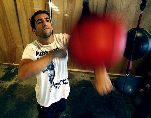 Jonathan Togo, the 33-year-old actor who plays investigator Ryan Wolfe in "CSI: Miami," is bemused by the celebrity real estate racket. Instead of buying into the hype that he needs more house, more furnishings he won't use and more security in the form of a gated neighborhood, Togo is happy with something smaller and more personal, he says. Two years ago he purchased his first home, a 1,800-square-foot Midcentury pad in the Hollywood Hills, and he asked himself: "What if I got a tiny house and filled it with the best things I love?" Dressed in gym shorts and a T-shirt with a stylized image of Muhammad Ali, Togo leads a tour through his house, where the garage has been converted into a personal boxing gym.