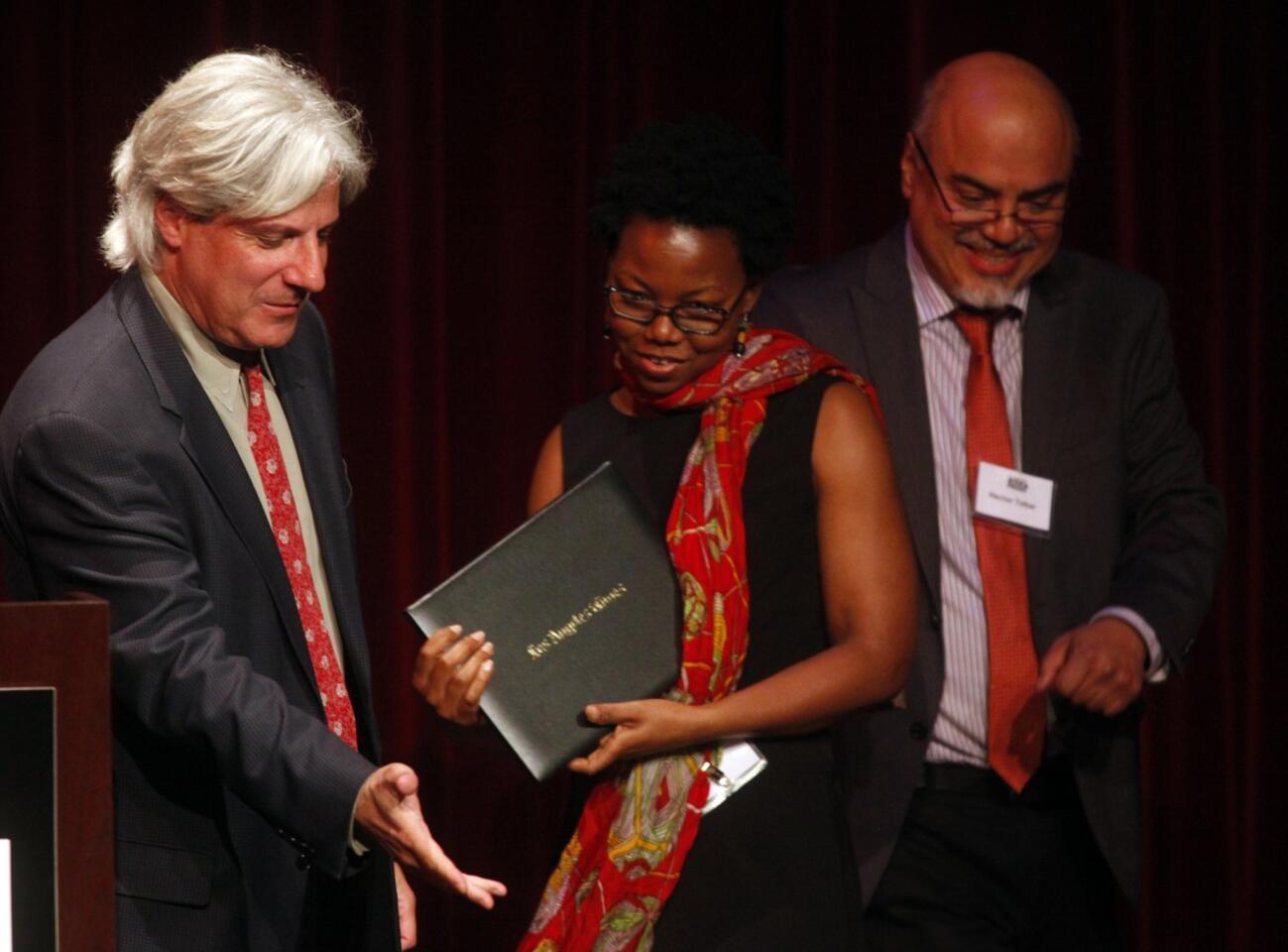 NoViolet Bulawayo, center, wins the Art Seidenbaum Award for first fiction for "We Need New Names." She is flanked by David L. Ulin, left, and Hector Tobar.