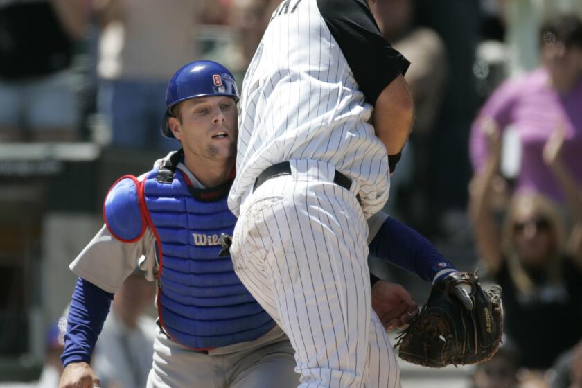 White Sox baserunner A.J. Pierzysnki collides with Cubs catcher Michael Barrett at home plate during the second inning at U.S. Cellular Field on May 20, 2006. The result?