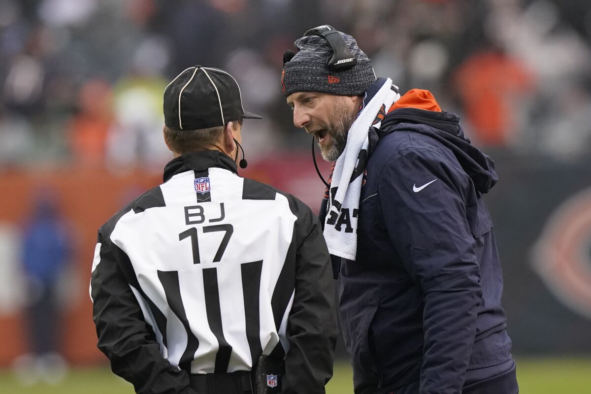 Chicago Bears head coach Matt Nagy talks to back judge Steve Patrick during the second half of an NFL football game against the Arizona Cardinals Sunday, Dec. 5, 2021, in Chicago. (AP Photo/Nam Y. Huh)