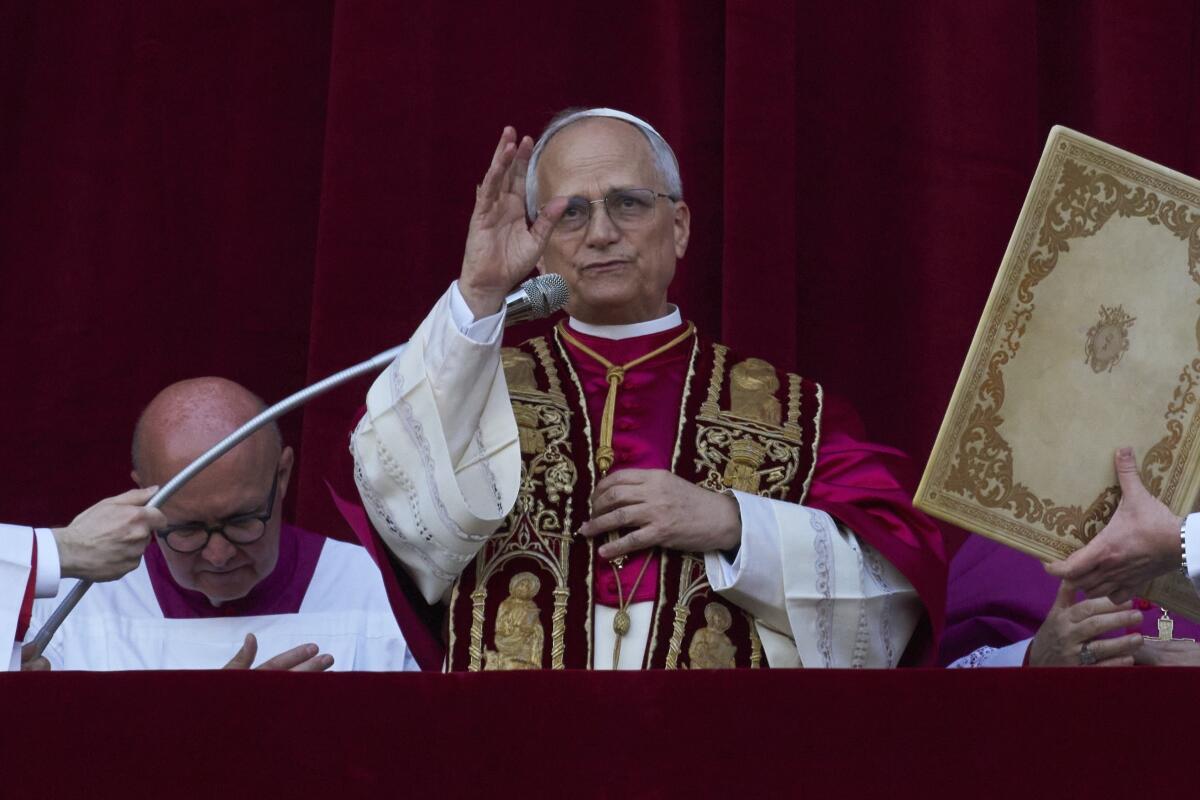 Newly elected Pope Leo XIV appears at the balcony of St. Peter's Basilica.