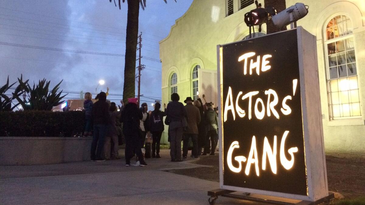 Members of the Actors' Gang in Culver City gather in front of the theater on Jan. 19, the eve of Donald Trump’s inauguration, to turn on a "ghostlight" as a gesture of tolerance.