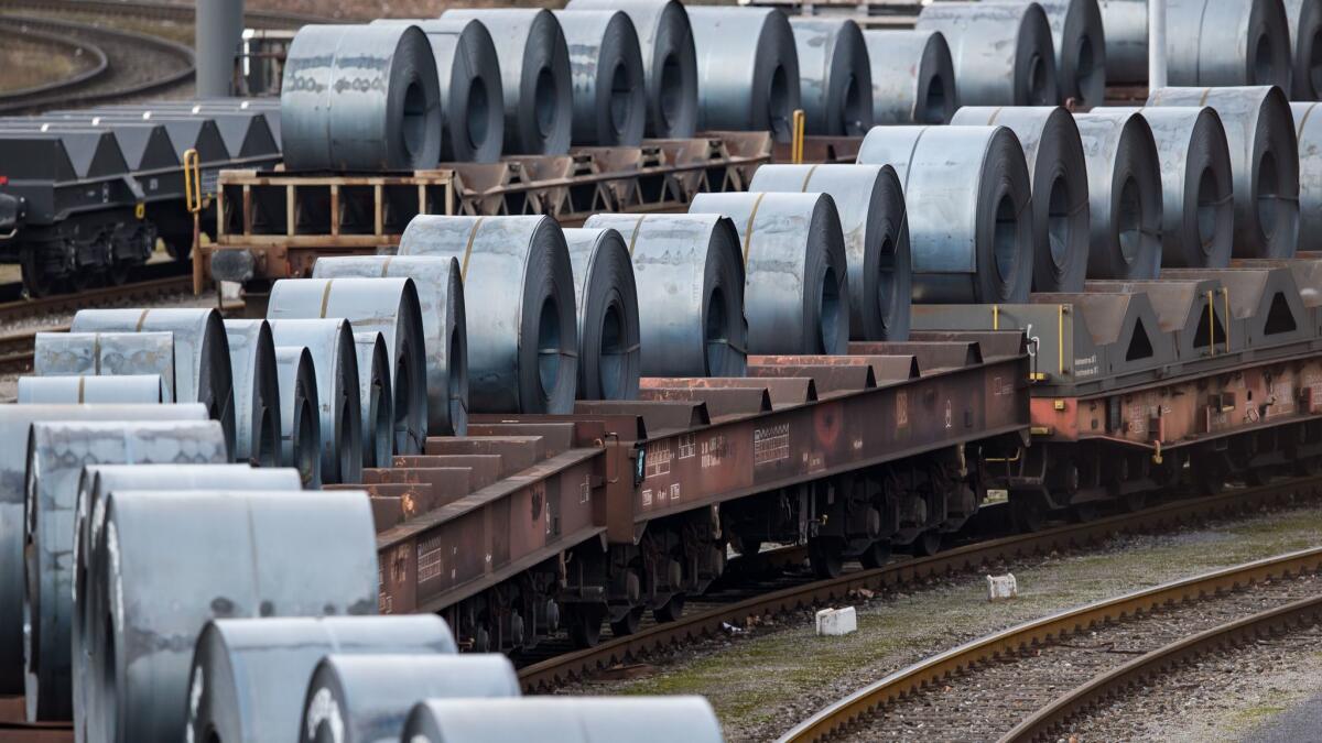 Coils are stored on trains in front of the ThyssenKrupp steel mill in Duisburg, Germany, on March 5.