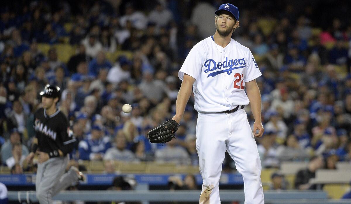 Dodgers pitcher Clayton Kershaw reacts after giving up a three-run home run to Miami Marlins' Giancarlo Stanton during the sixth inning at Dodger Stadium on Tuesday.