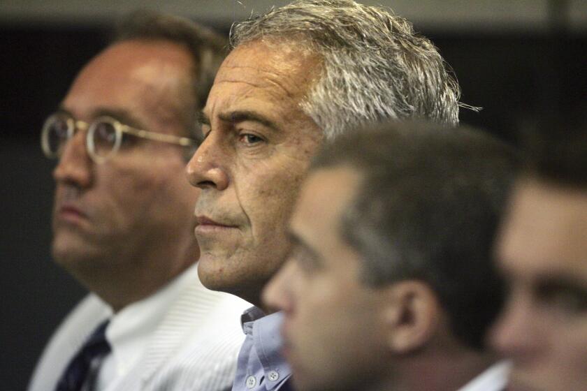 FILE- In this July 30, 2008, file photo, Jeffrey Epstein appears in court in West Palm Beach, Fla. Newly unsealed court documents provide a fresh glimpse into a fierce civil court fight between Epstein's ex-girlfriend, Ghislaine Maxwell, and one of the women who accused the couple of sexual abuse. The documents released Thursday, July 30, 2020, were from a now-settled defamation lawsuit filed by one of Epstein's alleged victims, Virginia Roberts Giuffre. (Uma Sanghvi/Palm Beach Post via AP, File)